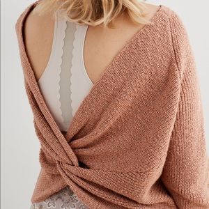 Aerie twist back sweater in a salmon color.